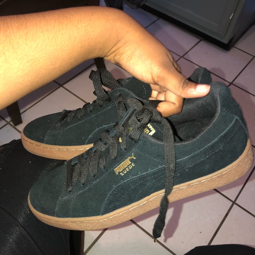 Black suede pumas
